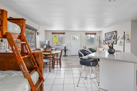 Open-concept layout with bar seating and effortless indoor-outdoor flow.