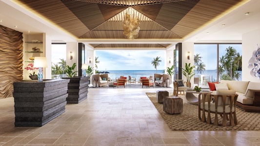 A grand, ocean-view lobby greets you upon arrival.