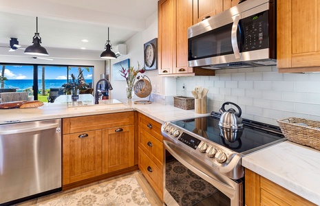 Fully equipped kitchen featuring high-end appliances and warm wooden cabinetry for a luxurious touch.