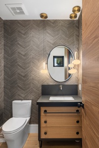Chic powder room adds effortless elegance and convenience for guests between adventures.