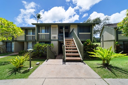 Spacious living area with dining table, TV, and access to your private lanai.