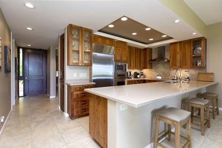 Enjoy the airy great room with sweeping views of the golf course and the crashing waves just beyond.