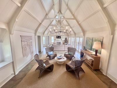 Stylish sitting area under high, vaulted ceilings—perfect for enjoying coffee and conversation