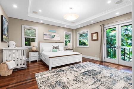 Elegant nursery suite with area rug, natural light, and garden views.