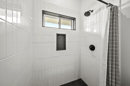 The separate walk-in shower offers a refreshing start or end to your day.