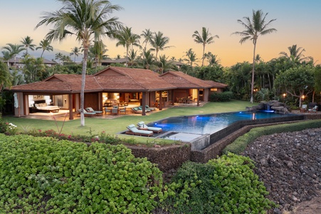 Twilight ambiance at the poolside lanai with glowing sunset skies.