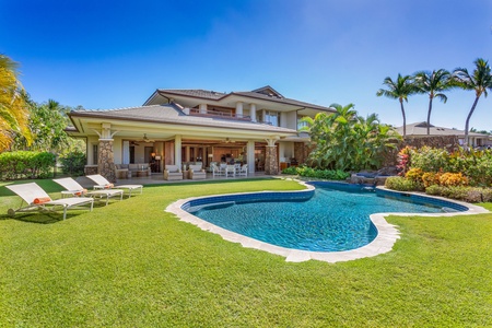 Relax in your own tropical oasis, complete with a sparkling pool, soothing spa, and gentle waterfall surrounded by lush greenery.
