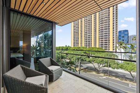 Stylish balcony with intimate seating, ideal for quiet moments.