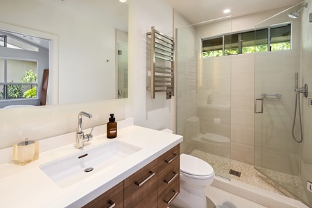 Modern full bath with walk-in shower and double vanity—stylish and functional.