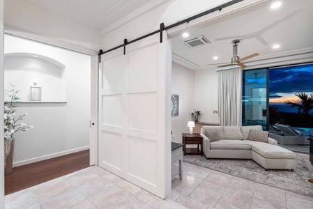Bonus room with sliding barn doors, lanai access, and ocean views.