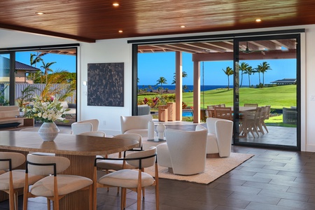Indoor dining framed by warm wood ceilings and island views.