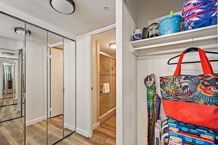 A well-organized hallway closet in Mahana 718 offers easy access to beach essentials.
