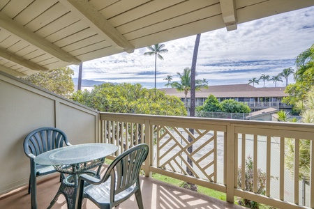 Enjoy morning coffee on your lanai overlooking tropical palms and peaceful garden views.