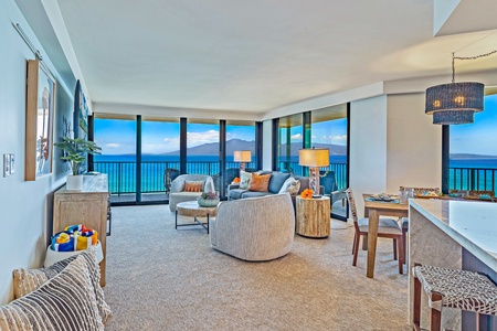 Kaanapali Shores 702’s kitchen features modern appliances, island seating, and ocean views.