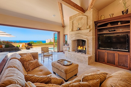 Living room with big TV and multiple media sources, gas fireplace, and unforgettable view