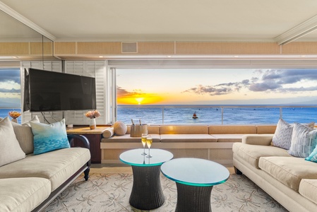 Spacious living area with ocean views and vibrant decor.