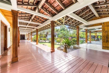 Grand covered walkways connect indoor and outdoor spaces with timeless island elegance.