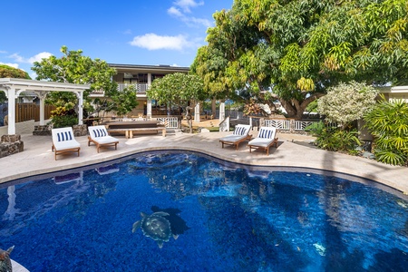 Relax on the chaise loungers poolside.