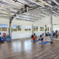 The yoga studio provides a serene space for group or personal sessions, designed to help you unwind and rejuvenate.