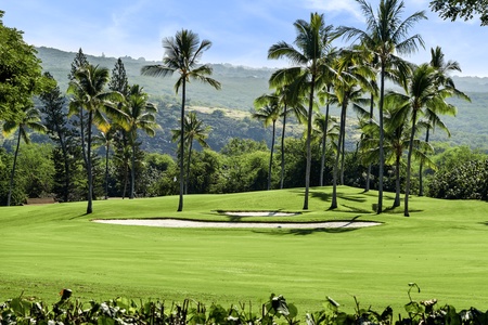 Panoramic golf course views await at Kona Blue Vacations Holua Kai, with peaceful greens right outside.