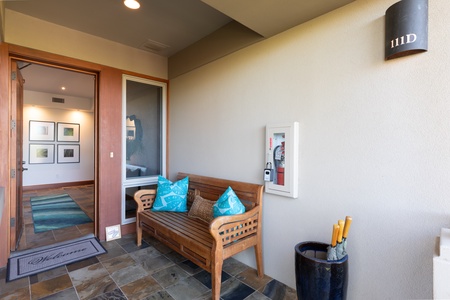 Inviting entryway with comfortable seating and tasteful decor.