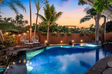 Your private tropical oasis awaits with a stunning heated pool with magical sunset lighting.