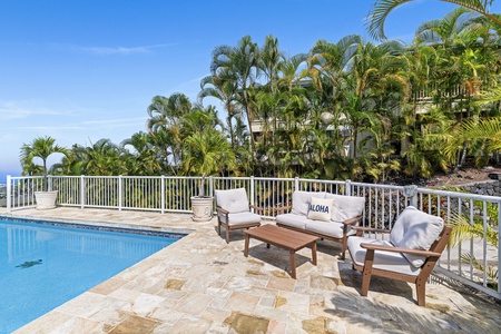 Soak up the tropical paradise with your private pool oasis, surrounded by swaying palms and comfortable lounge seating for ultimate relaxation.