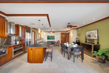 The open floor plan for the kitchen, living and dining areas.