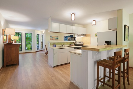 The breakfast bar offers additional seating, and opens up to the living room, so everyone can fraternize while the chef whips up a delicious meal.