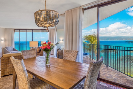 The dining area offers a beautiful view of the ocean, creating the perfect setting for meals while enjoying the island breeze.