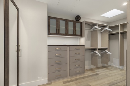 Spacious walk-in closet with custom storage, keeping your wardrobe organized during long stays.