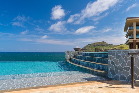 The two-tier, infinity-edge Kaiholo pool seems to flow right into the ocean.