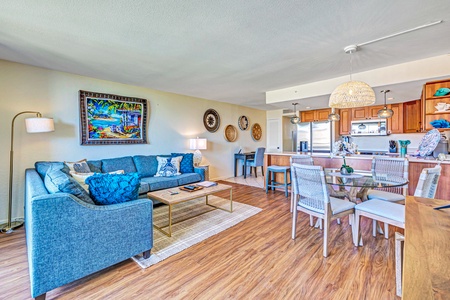 The dining area at Kaanapali Shores 746 offers seating for four, bathed in natural light from nearby windows.
