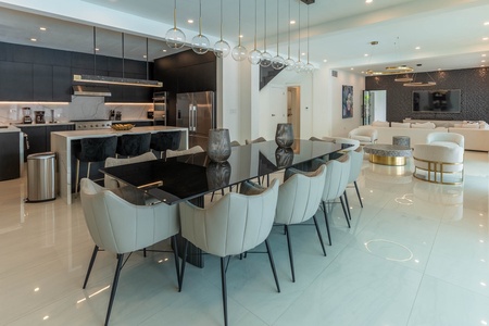 Gather and dine in the dining area with table for ten.