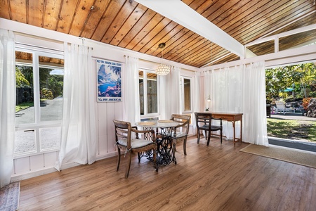 Step into your bright dining space with soaring wood ceilings, vintage charm, and French doors opening to the garden.