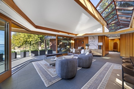 Spacious lounge area with skylights, blending indoor and outdoor living.