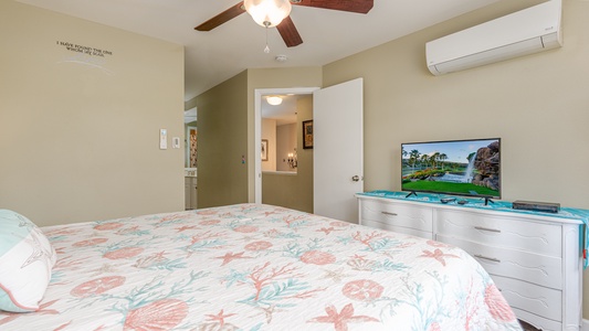 Relax in your comfortable bedroom with cheerful tropical bedding, flat-screen TV, and air conditioning to keep you cool.