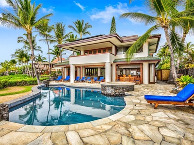 This luxury, 2-story oceanfront estate on Big Island boasts one of the best locations on the entire Kona coast