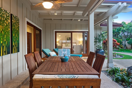 Outdoor Dining area with seating for six, offering a cozy setting for al fresco meals amidst tropical surroundings.