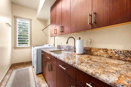 Granite folding counter, deep utility sink, and full-size machines