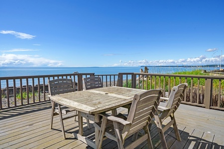 Dine al fresco on the deck while enjoying stunning ocean views at Sandy Point Sanctuary.