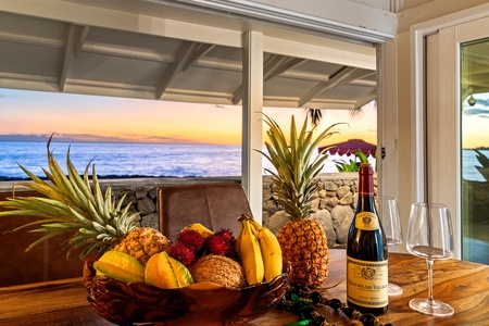 Tropical fruit, wine, and sunset views set the stage for unforgettable Kona evenings.