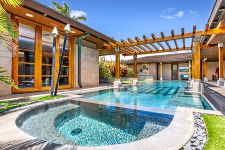 Pool with spa jets and shaded pergola.