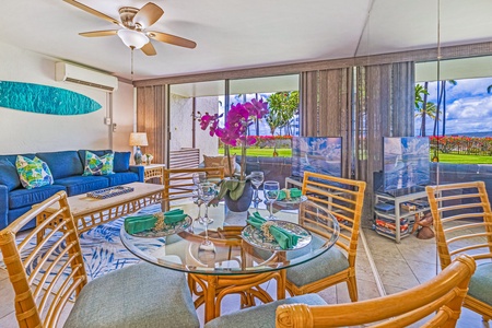 Share meals in Papakea K-105’s open dining area with garden views and seamless lanai access.