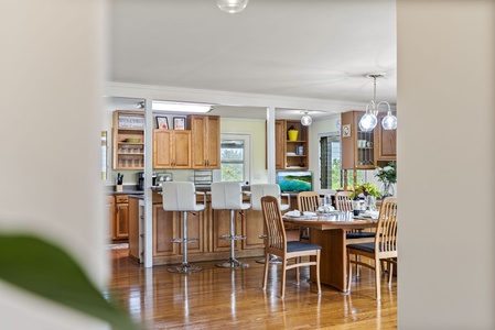 The dining and kitchen areas blend together for easy entertaining and shared moments.