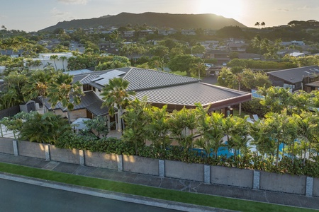 A stunning aerial view of the property, showcasing its grand architecture and lush surroundings.