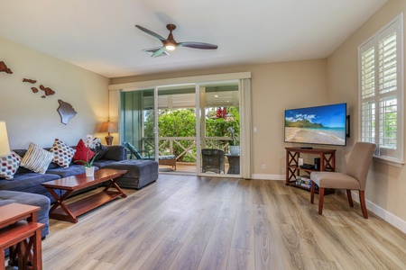 The living area looking to the lanai with garden views.