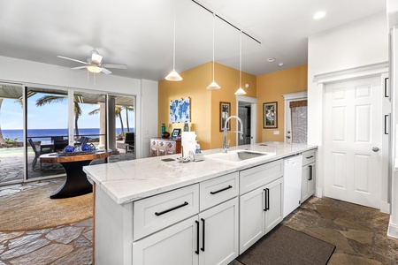 Bright and modern Kitchen offers additional prep and storage space.