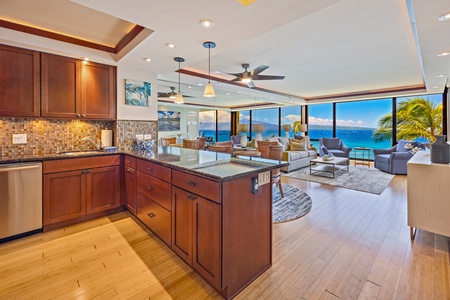 Bright and spacious kitchen with seamless flow to the living area and ocean views.