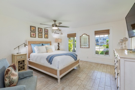 The guest bedroom features a queen-sized bed, split AC and ensuite bath.